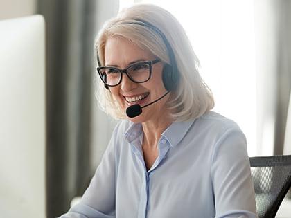 Person conducting a coaching conversation over the phone.